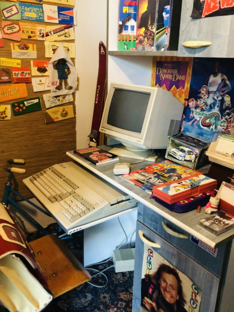 A computer at a desk with a CRT monitor